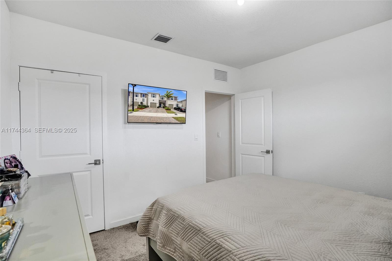 838 Southeast 17 Street Homestead, FL 33034 - Photo 20 of 66 a bedroom with a bed and a painting on the wall