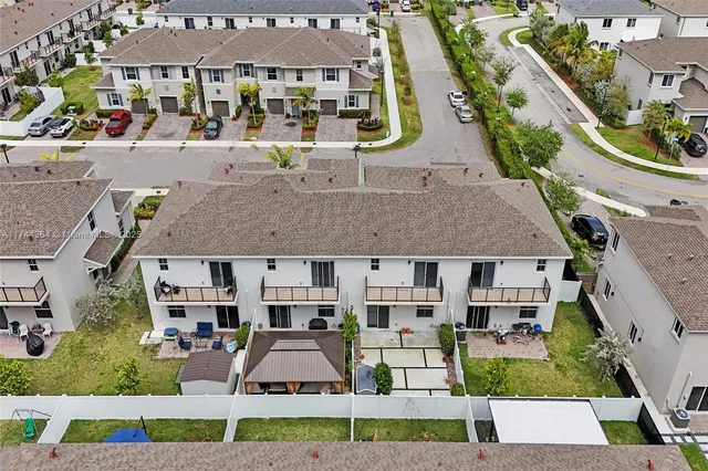 front view of a brick house with a yard