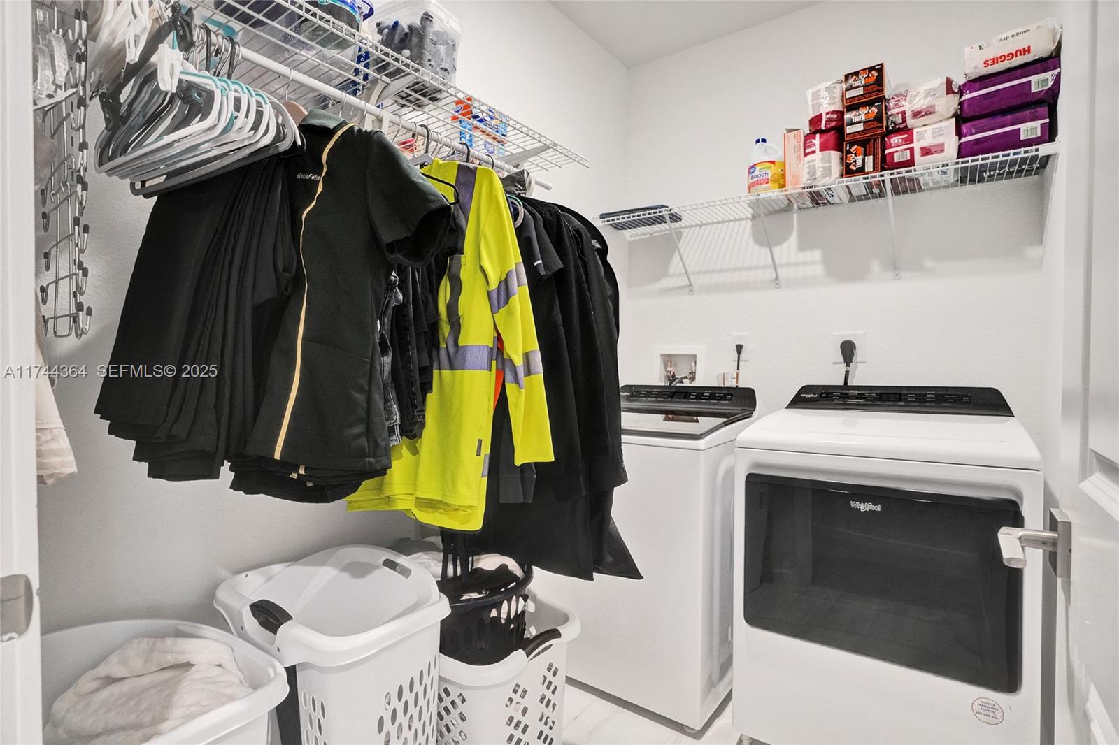 838 Southeast 17 Street Homestead, FL 33034 - Photo 24 of 66 a view of walk in closet with clothes and shoes