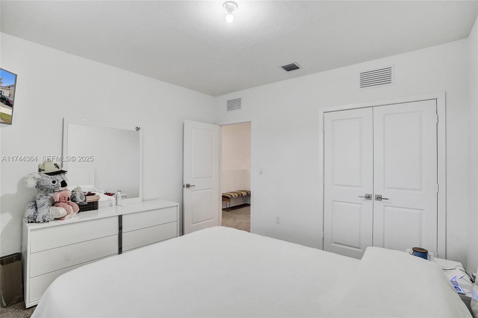 838 Southeast 17 Street Homestead, FL 33034 - Photo 25 of 66 a bedroom with a bed and a window