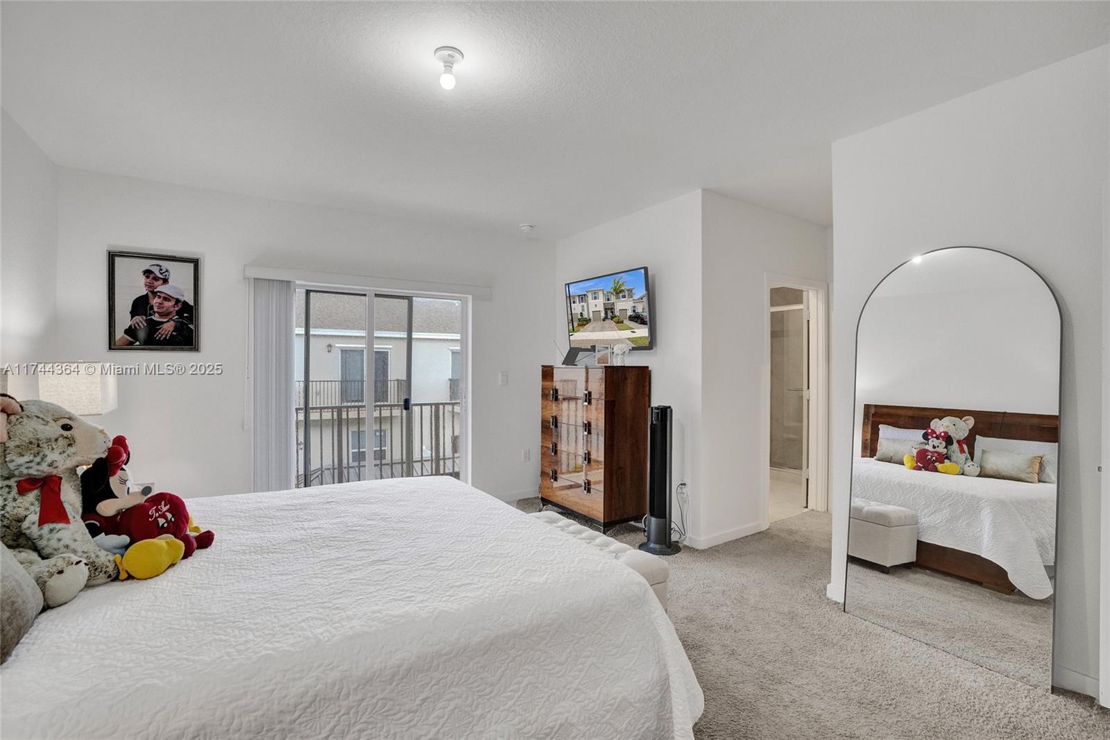 838 Southeast 17 Street Homestead, FL 33034 - Photo 32 of 66 a bedroom with a bed and a window