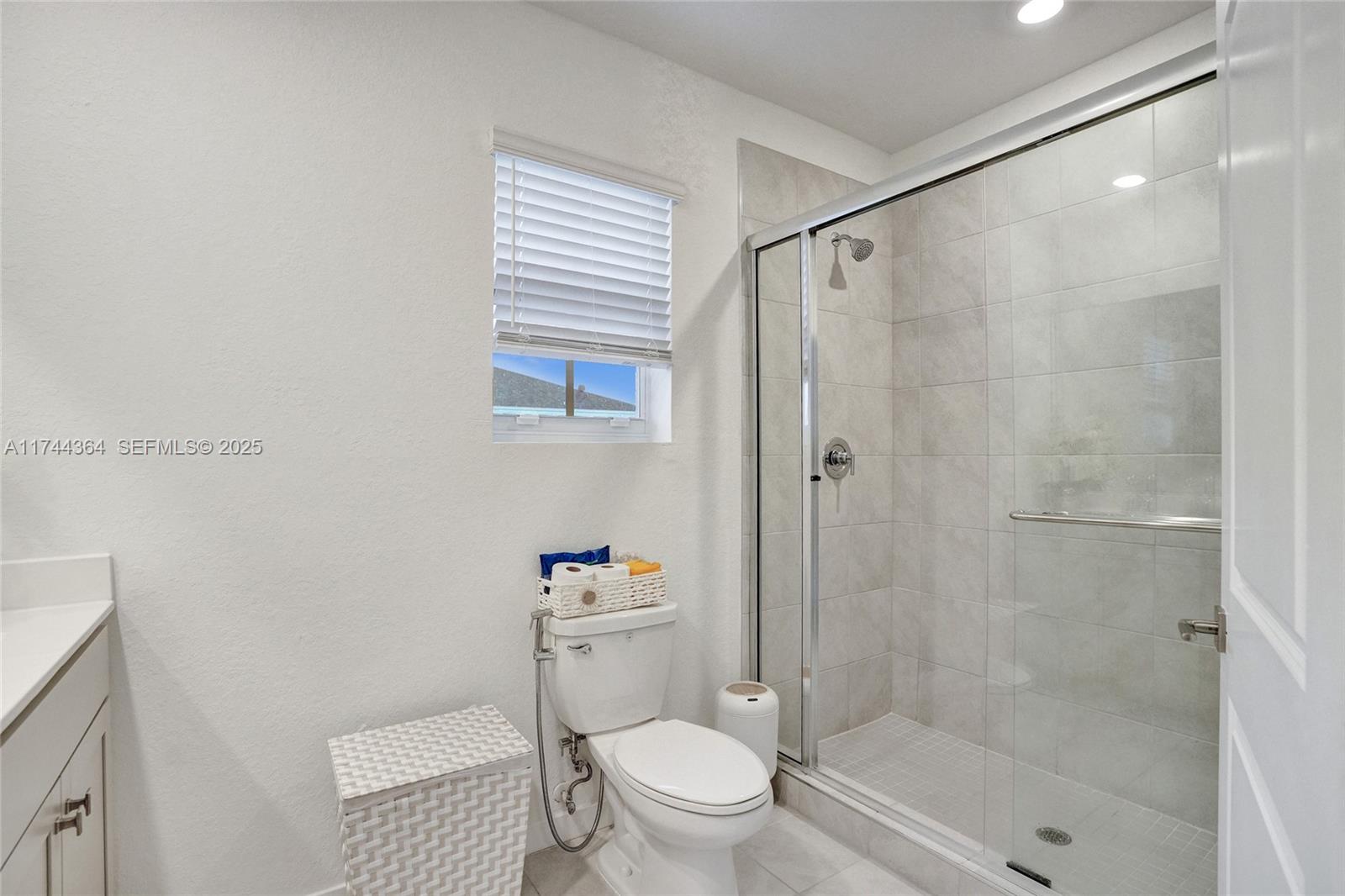 838 Southeast 17 Street Homestead, FL 33034 - Photo 35 of 66 a bathroom with a shower a toilet and a sink