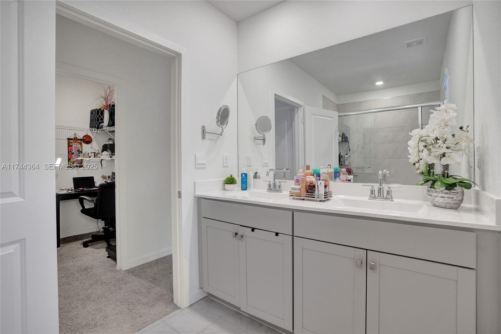 838 Southeast 17 Street Homestead, FL 33034 - Photo 36 of 66 a bathroom with a sink and a mirror