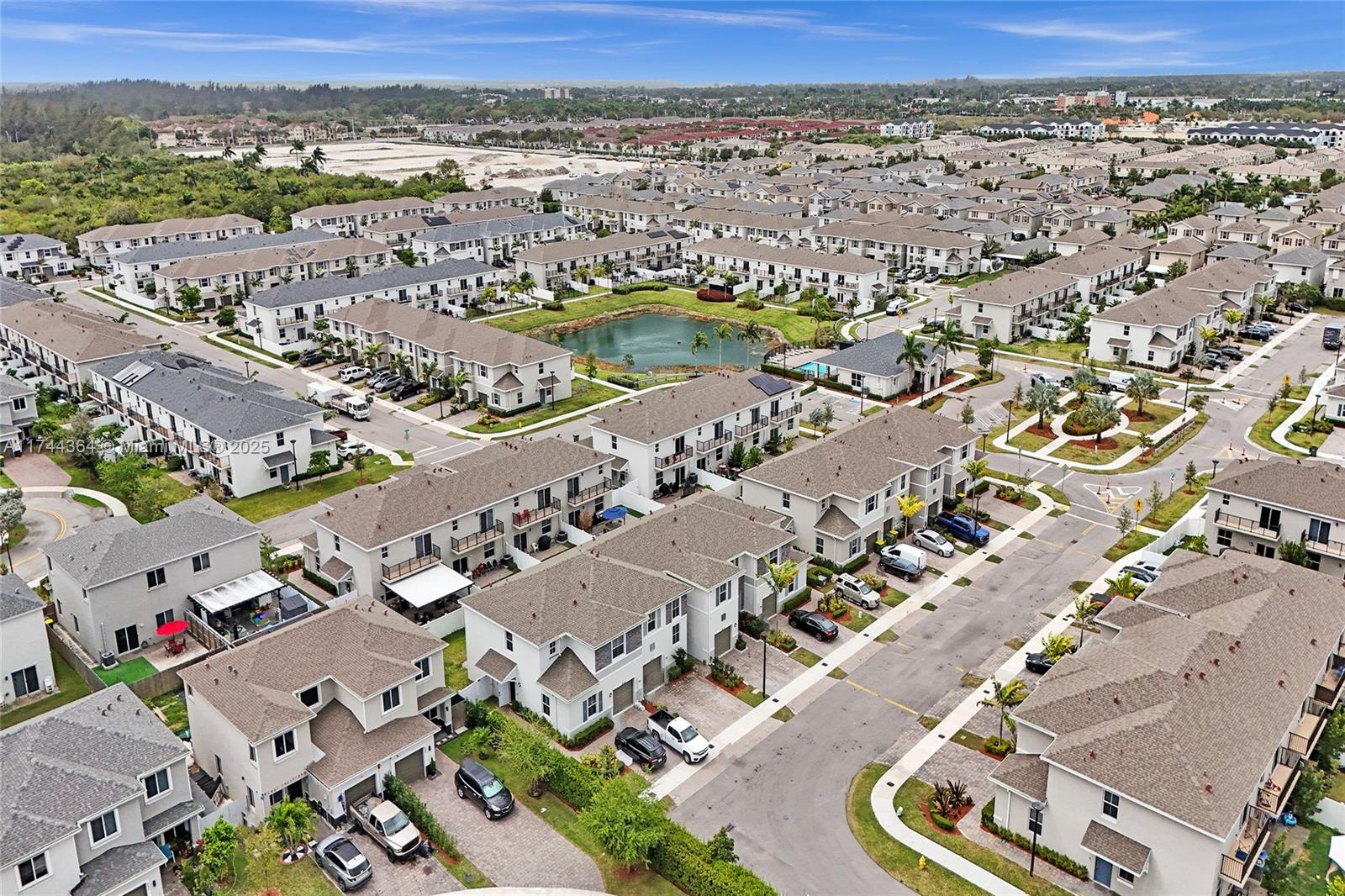 838 Southeast 17 Street Homestead, FL 33034 - Photo 56 of 66 an aerial view of a city with lots of residential buildings and mountain view in back