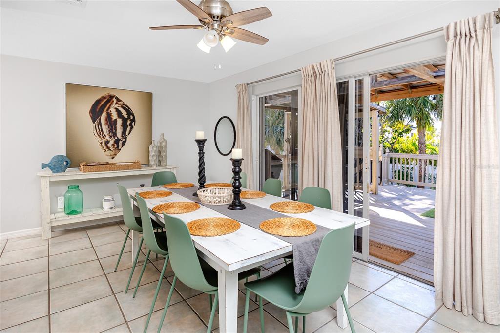 404 Maxwell Place Indian Rocks Beach, FL 33785 - Photo 16 of 66 a view of a dining table and chairs in a room