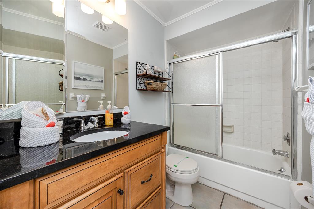 404 Maxwell Place Indian Rocks Beach, FL 33785 - Photo 23 of 66 a bathroom with a granite countertop sink toilet and shower
