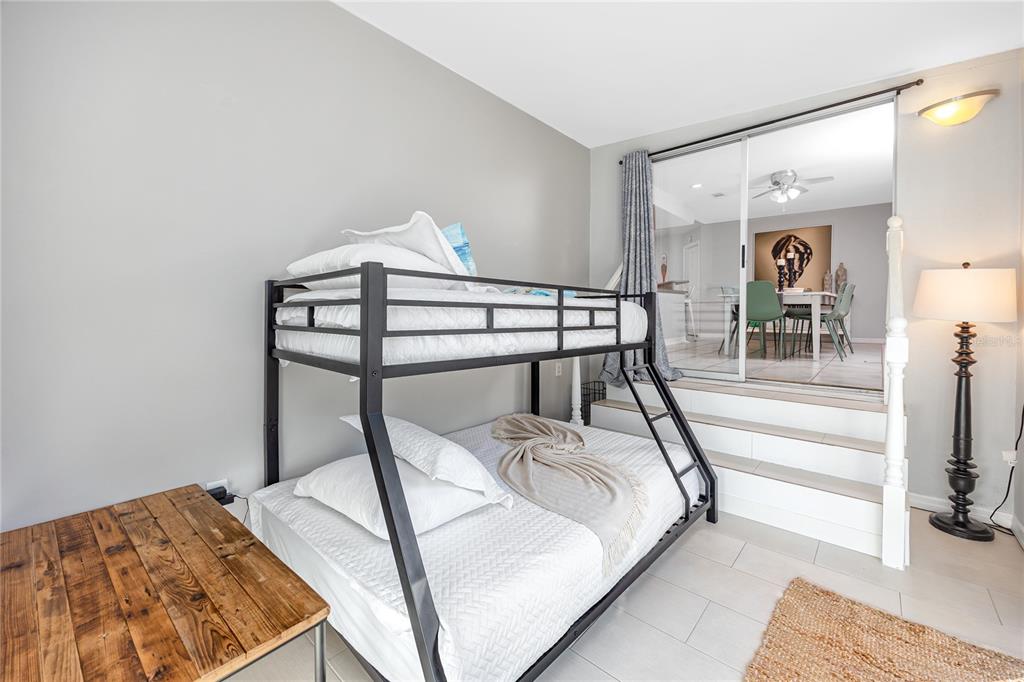 404 Maxwell Place Indian Rocks Beach, FL 33785 - Photo 24 of 66 a bed sitting in a bedroom next to a window