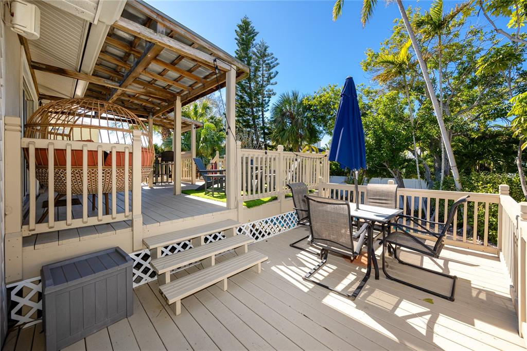 404 Maxwell Place Indian Rocks Beach, FL 33785 - Photo 29 of 66 a view of porch with a bench