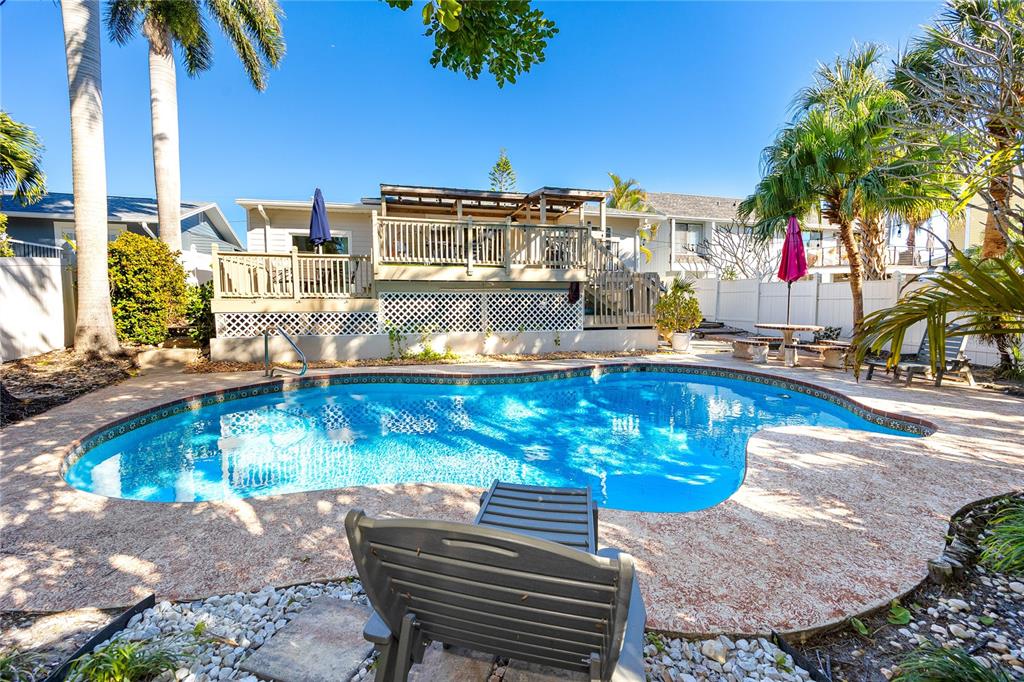 404 Maxwell Place Indian Rocks Beach, FL 33785 - Photo 4 of 66 a view of a house with outdoor seating