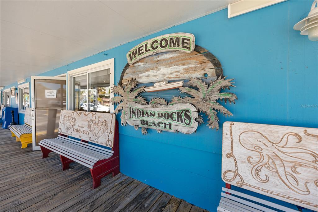 404 Maxwell Place Indian Rocks Beach, FL 33785 - Photo 56 of 66 a view of a room with furniture and wooden floor