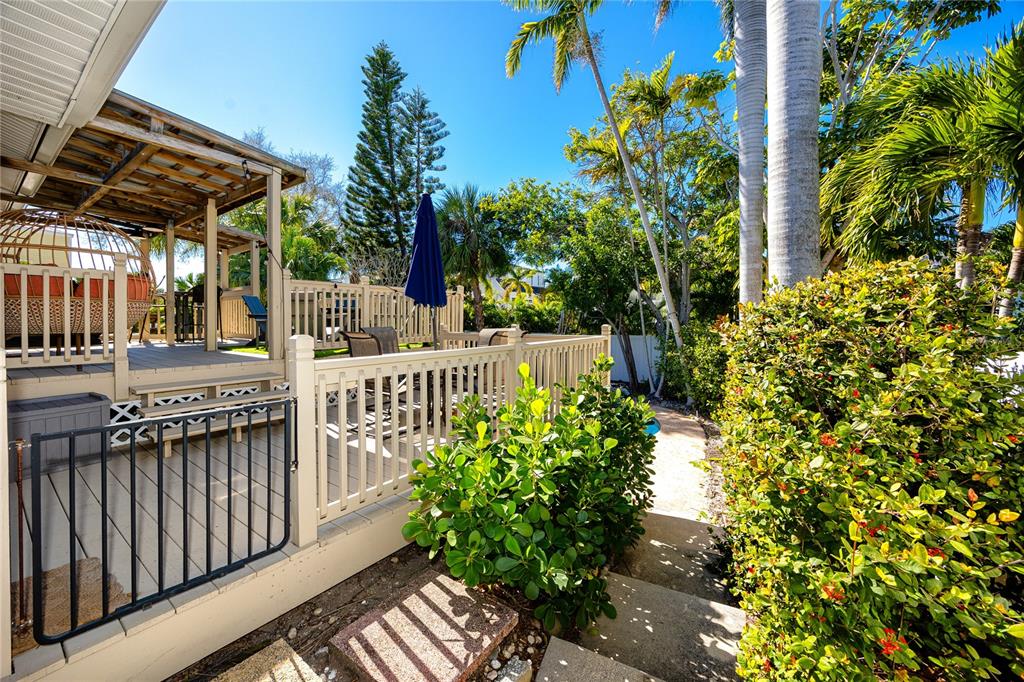 404 Maxwell Place Indian Rocks Beach, FL 33785 - Photo 66 of 66 a view of a porch with a bench