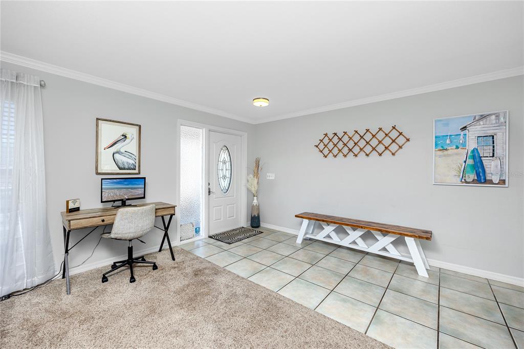 404 Maxwell Place Indian Rocks Beach, FL 33785 - Photo 7 of 66 a bench sitting in a room next to a window