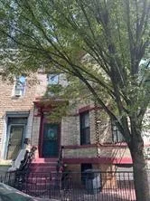 a front view of house with outdoor space