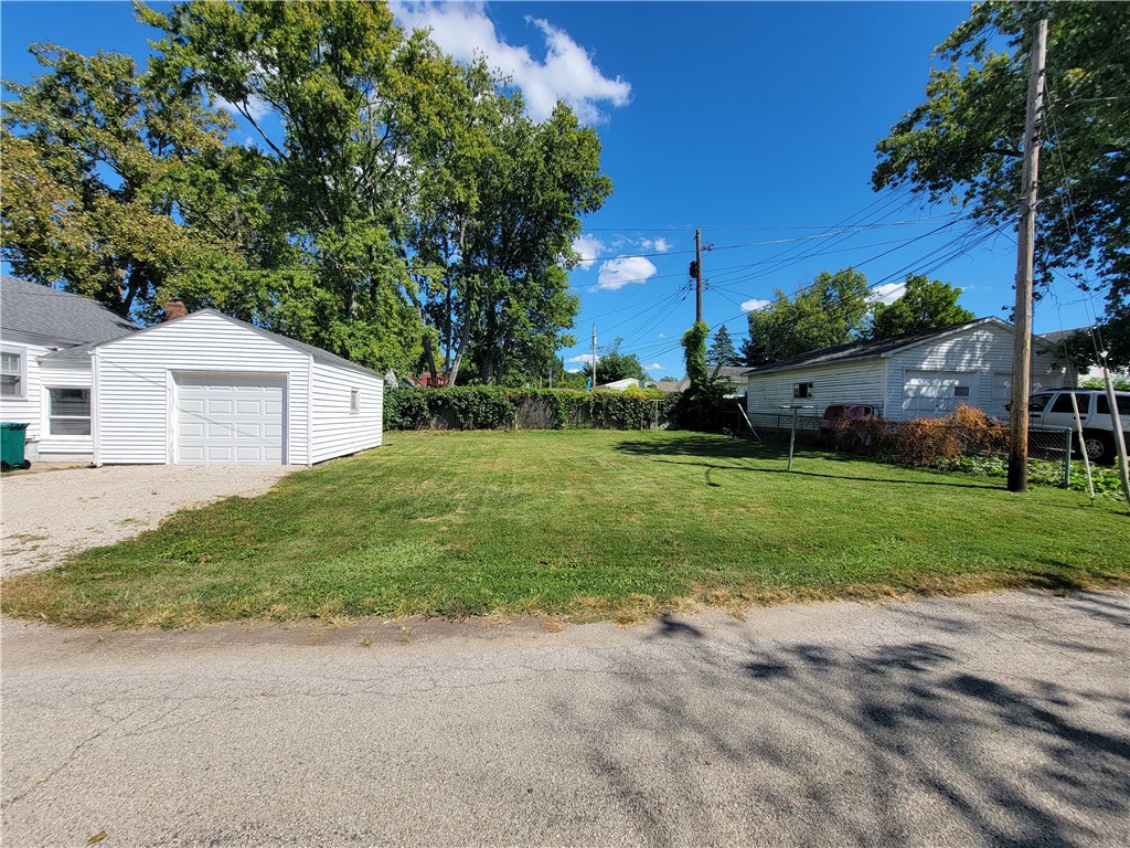 2195 West Center Street Decatur, IL 62526 - Photo 21 of 21 a view of a house with backyard and tree
