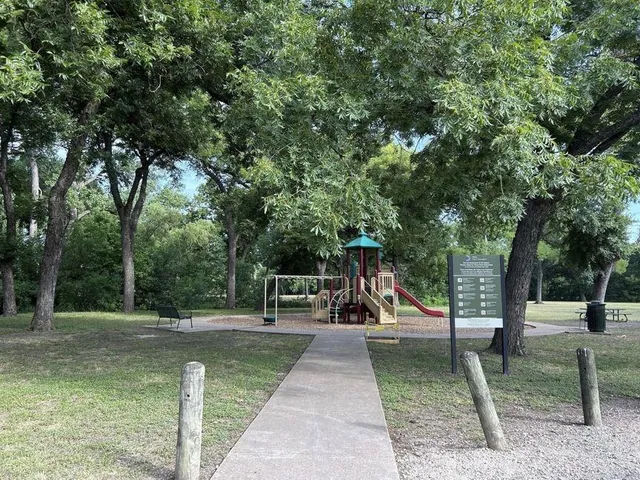 a view of a park with swings