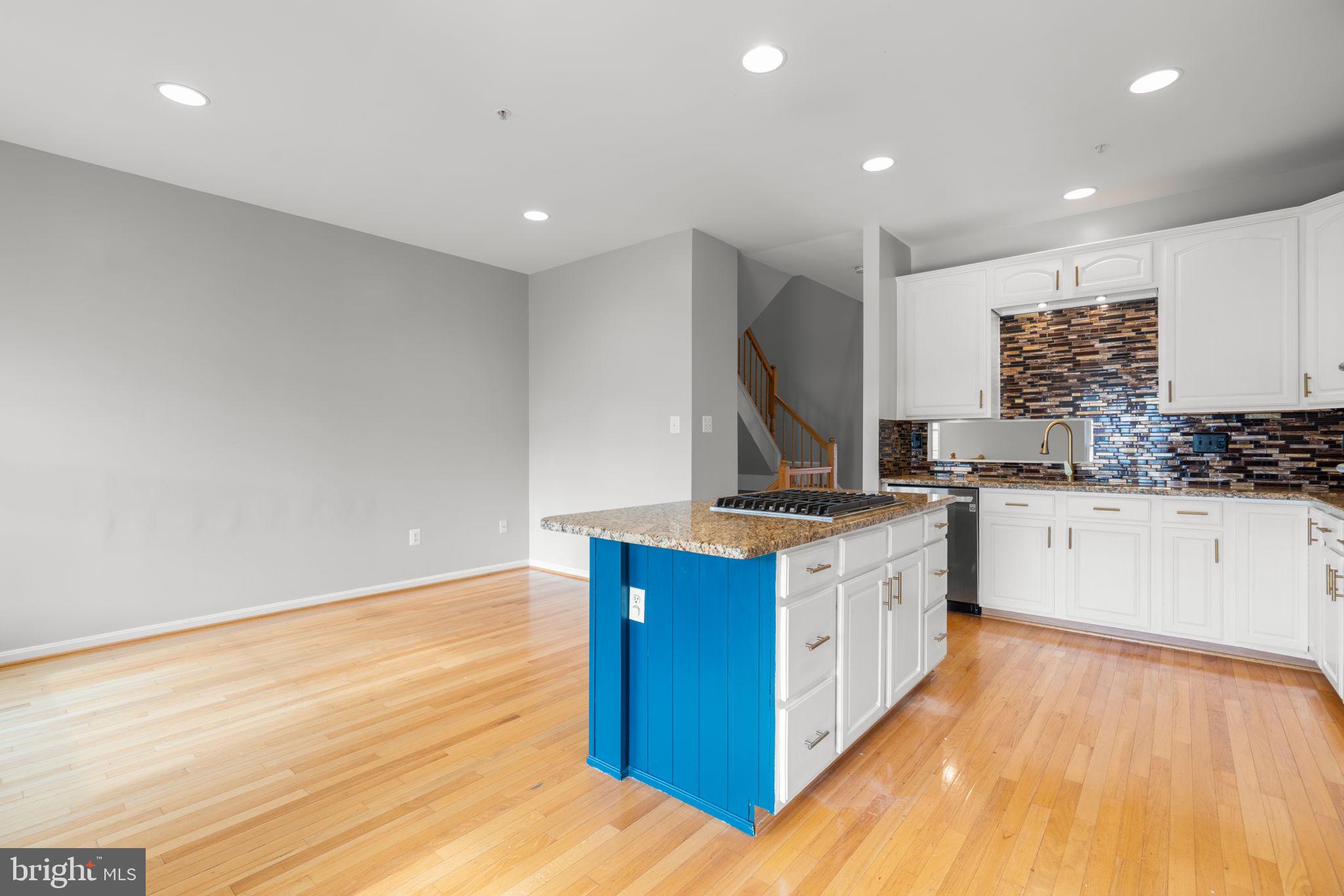 2475 Jostaberry Way Odenton, MD 21113 - Photo 12 of 53 a kitchen with stainless steel appliances granite countertop a stove a sink and a refrigerator
