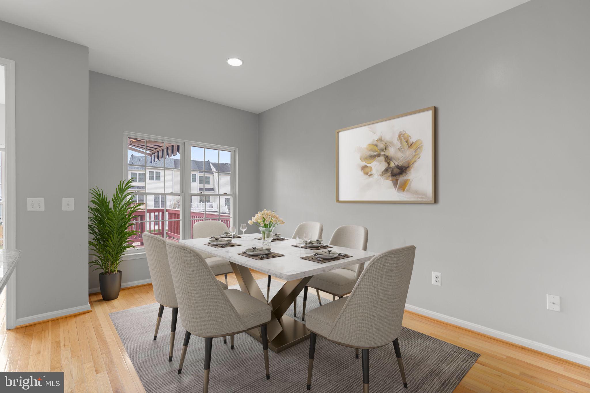 2475 Jostaberry Way Odenton, MD 21113 - Photo 15 of 53 a view of a dining room with furniture and wooden floor