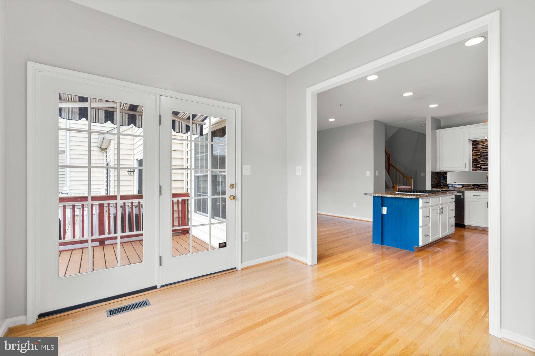2475 Jostaberry Way Odenton, MD 21113 - Photo 17 of 53 a kitchen with stainless steel appliances kitchen island granite countertop a refrigerator and a sink