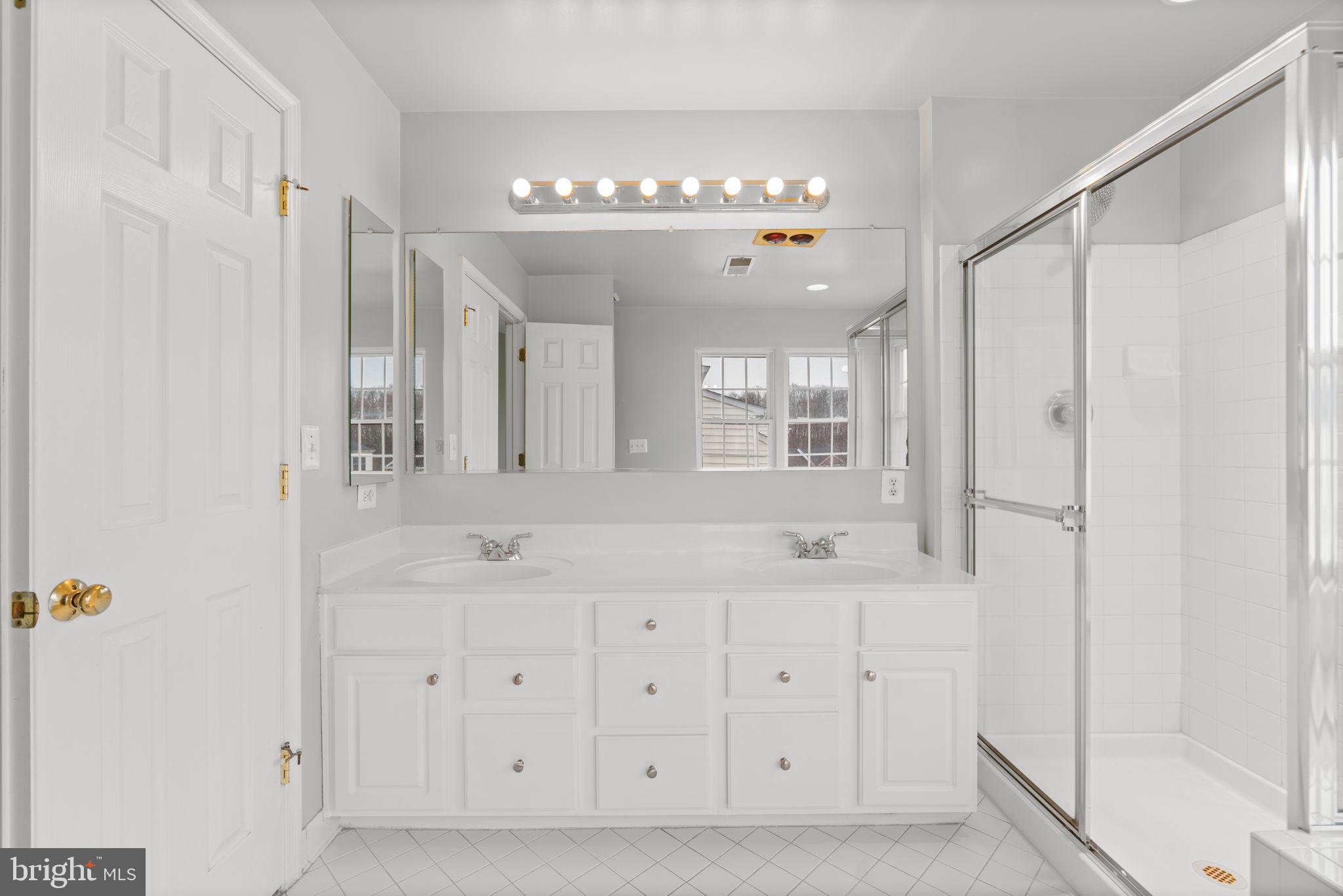 2475 Jostaberry Way Odenton, MD 21113 - Photo 27 of 53 a bathroom with a double vanity sink mirror and