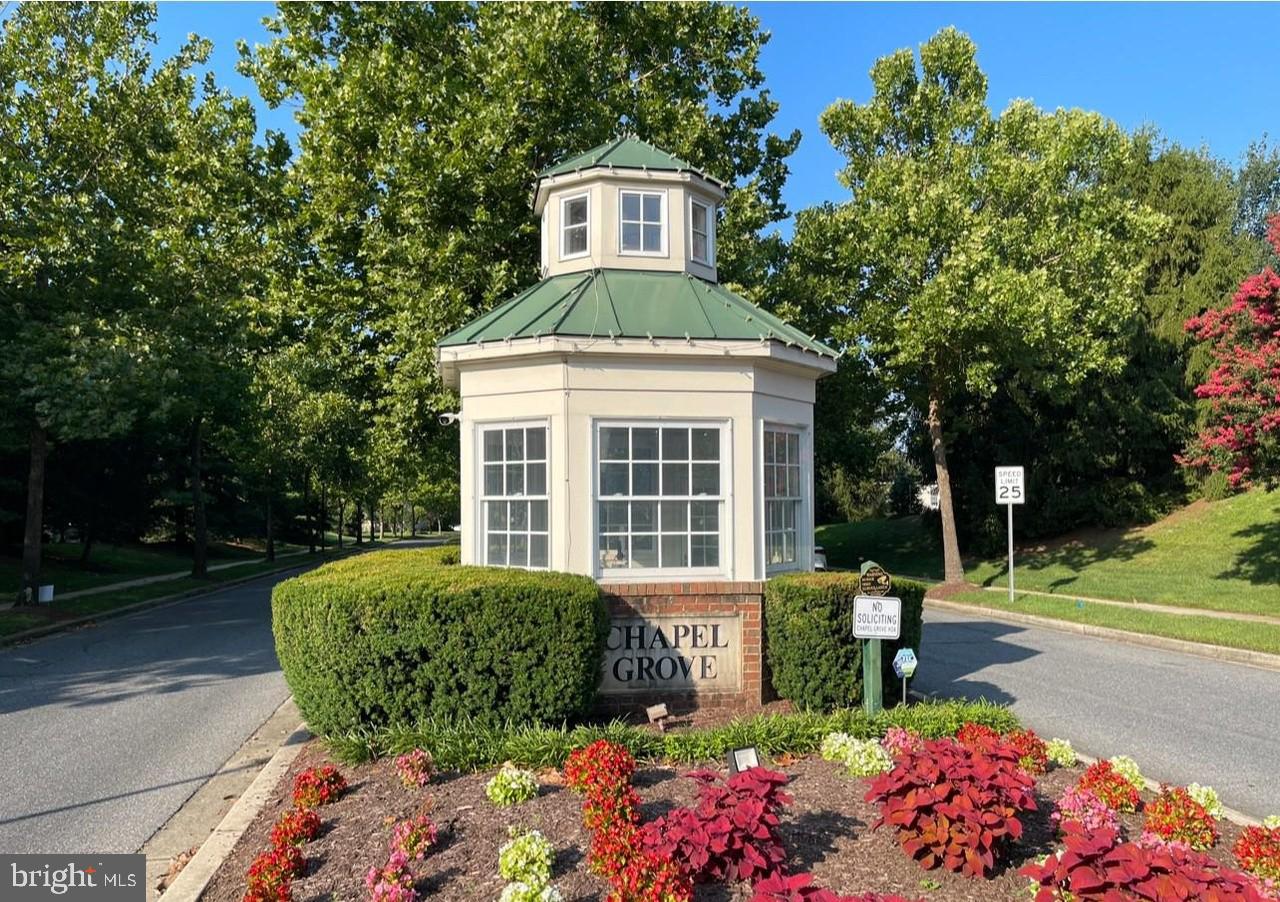 2475 Jostaberry Way Odenton, MD 21113 - Photo 48 of 53 a front view of a house with garden
