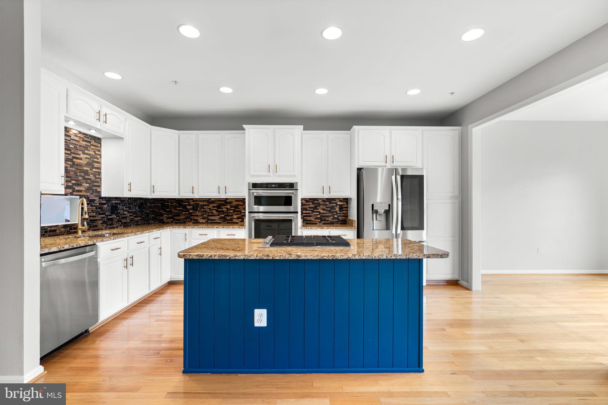 2475 Jostaberry Way Odenton, MD 21113 - Photo 9 of 53 a kitchen with stainless steel appliances granite countertop a sink a stove and refrigerator