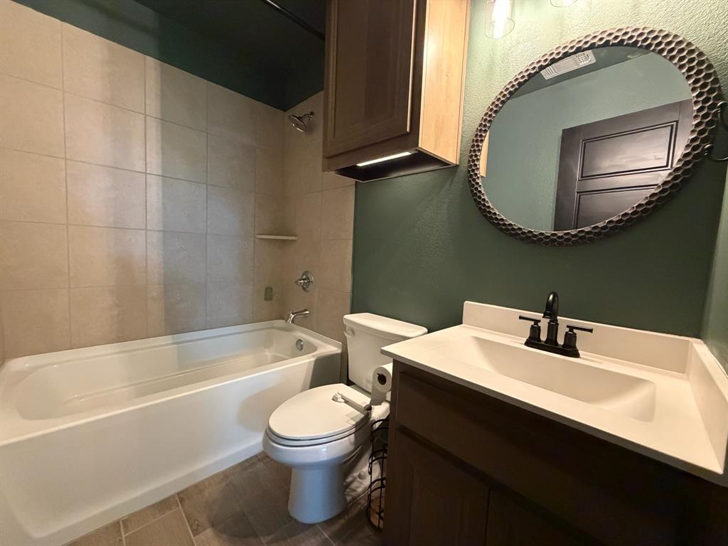 4420 Norcross Lane Crowley, TX 76036 - Photo 12 of 16 a bathroom with a sink and a mirror