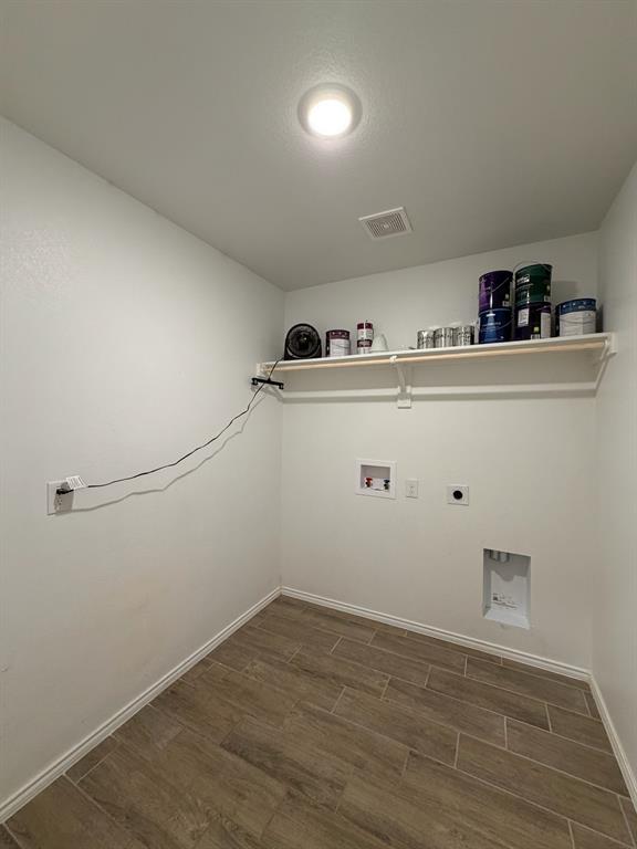 4420 Norcross Lane Crowley, TX 76036 - Photo 13 of 16 a view of storage and utility room with empty racks