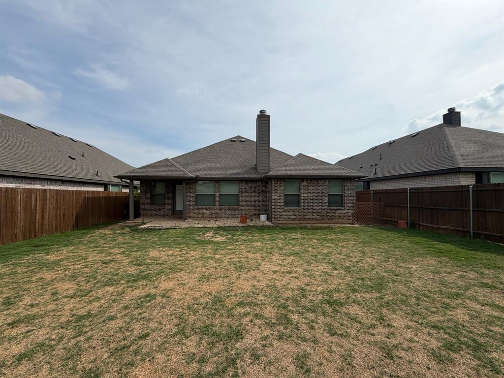 4420 Norcross Lane Crowley, TX 76036 - Photo 15 of 16 a backyard of a house with lots of green space