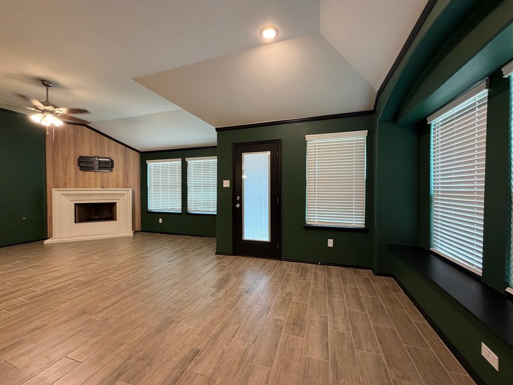 4420 Norcross Lane Crowley, TX 76036 - Photo 2 of 16 a view of an empty room with a window and fire place