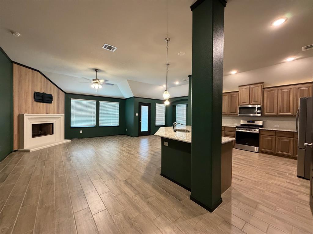 4420 Norcross Lane Crowley, TX 76036 - Photo 4 of 16 a view of kitchen with cabinets and wooden floor