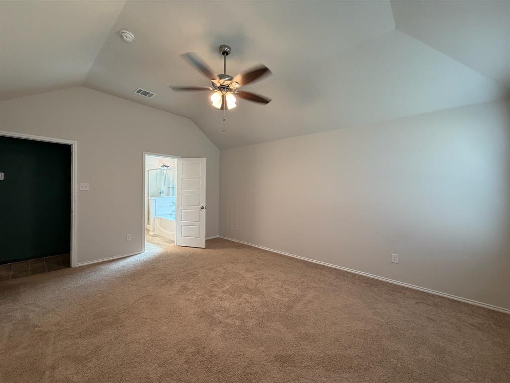 4420 Norcross Lane Crowley, TX 76036 - Photo 10 of 16 an empty room with windows and fan