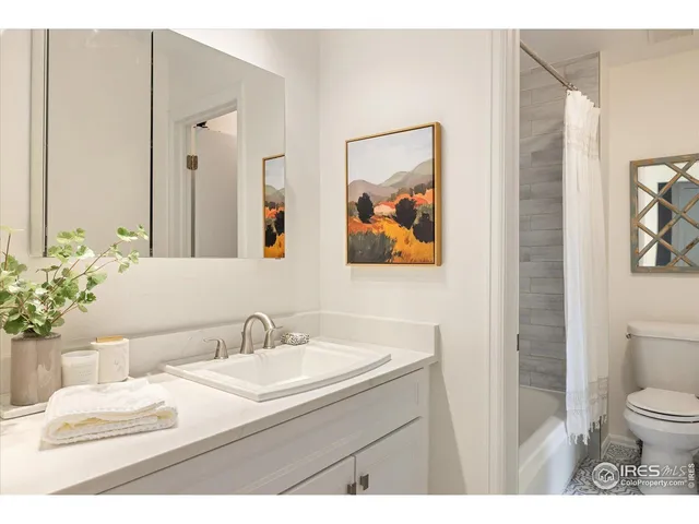 a bathroom with a sink vanity and a mirror