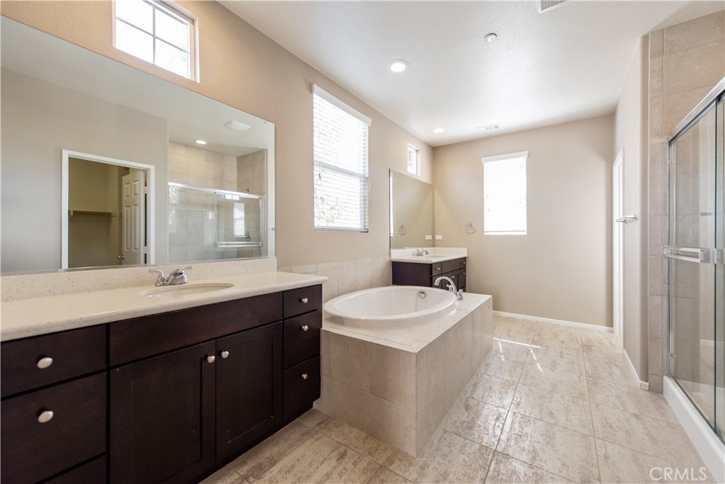 148 Compass Irvine, CA 92618 - Photo 17 of 26 a spacious bathroom with a double vanity sink mirror and
