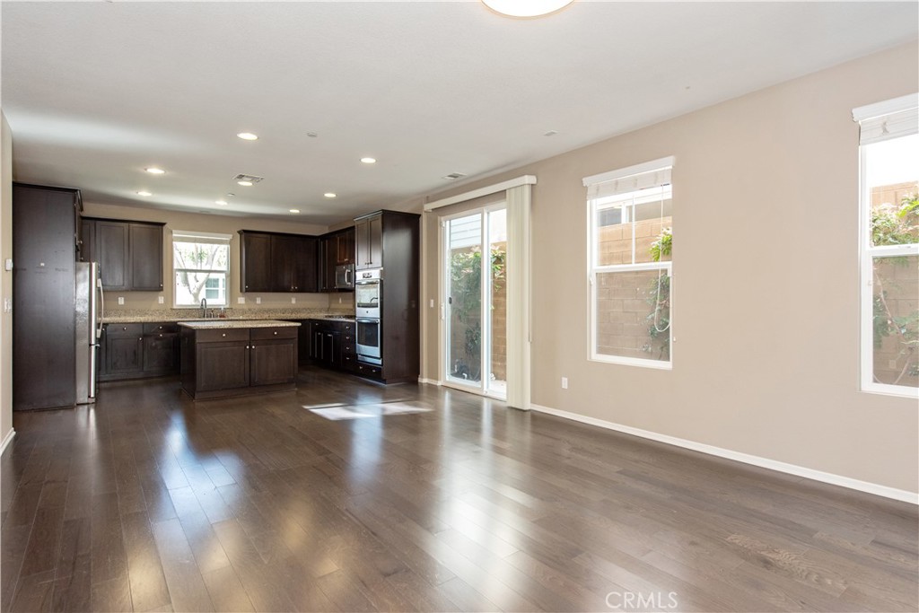 148 Compass Irvine, CA 92618 - Photo 8 of 26 a view of kitchen with refrigerator stove and wooden floor