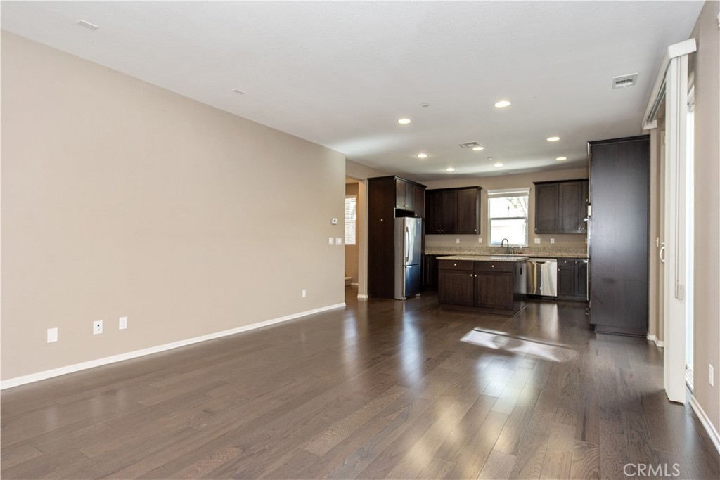 148 Compass Irvine, CA 92618 - Photo 9 of 26 a view of a kitchen with a sink and a refrigerator