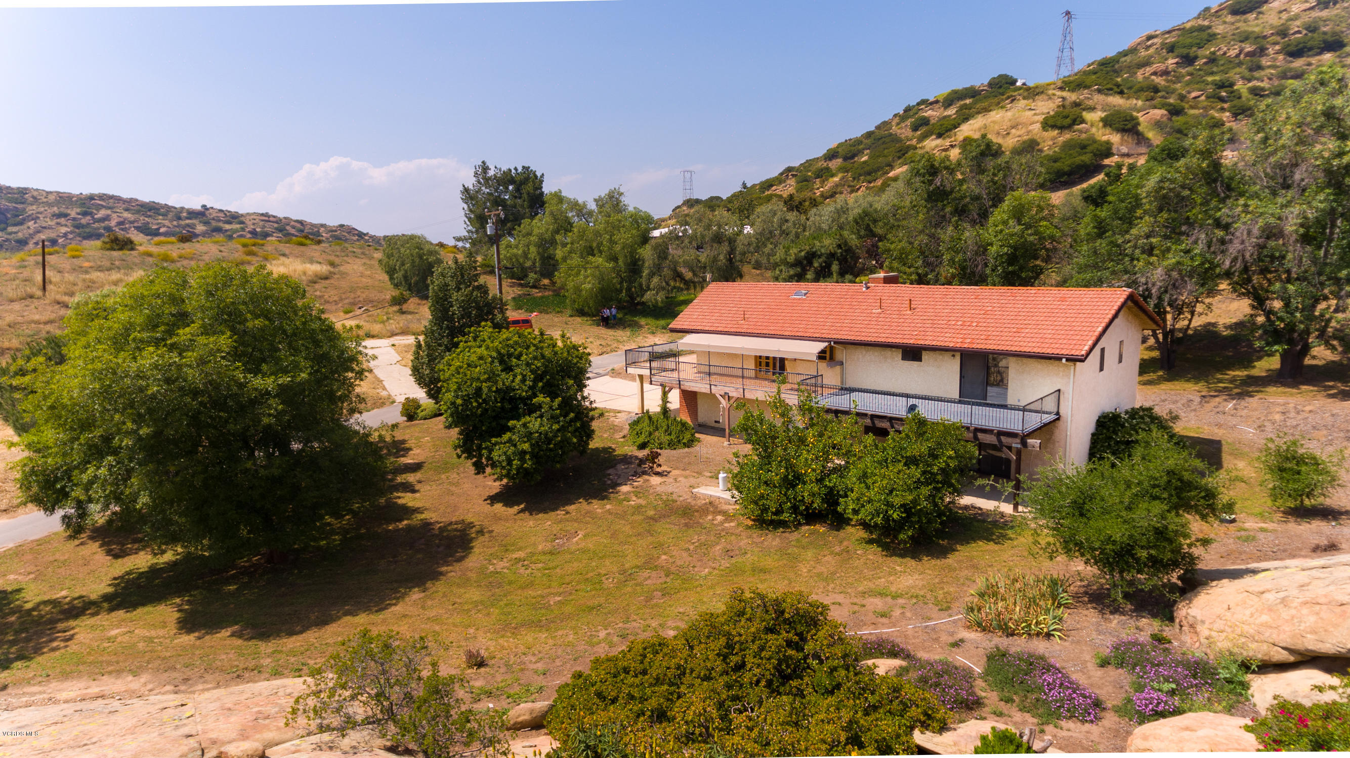 7240 Studio Road Canoga Park, CA 91304 - Photo 14 of 19 a front view of a house with a yard