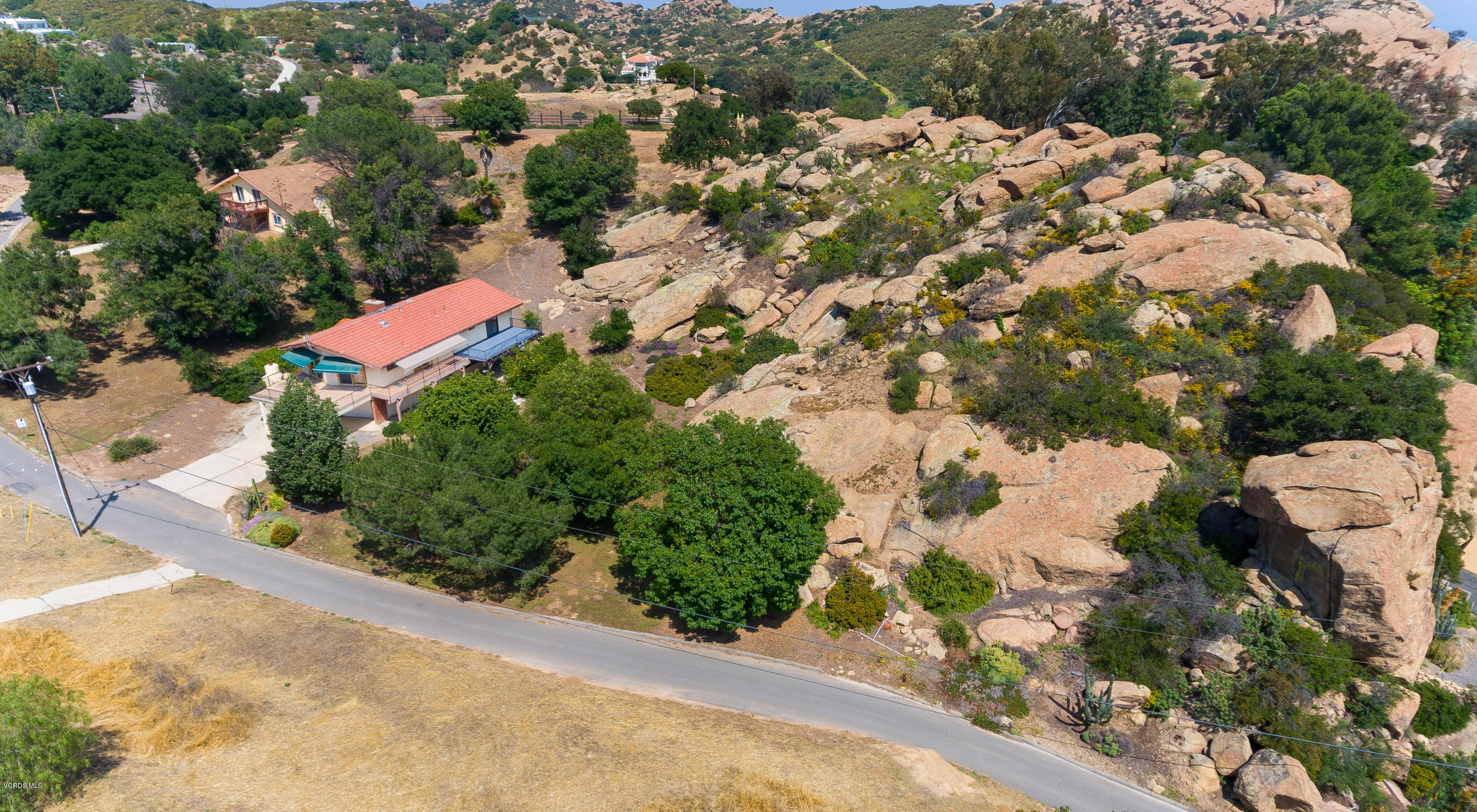 7240 Studio Road Canoga Park, CA 91304 - Photo 17 of 19 an aerial view of a house with a yard and lake view in back