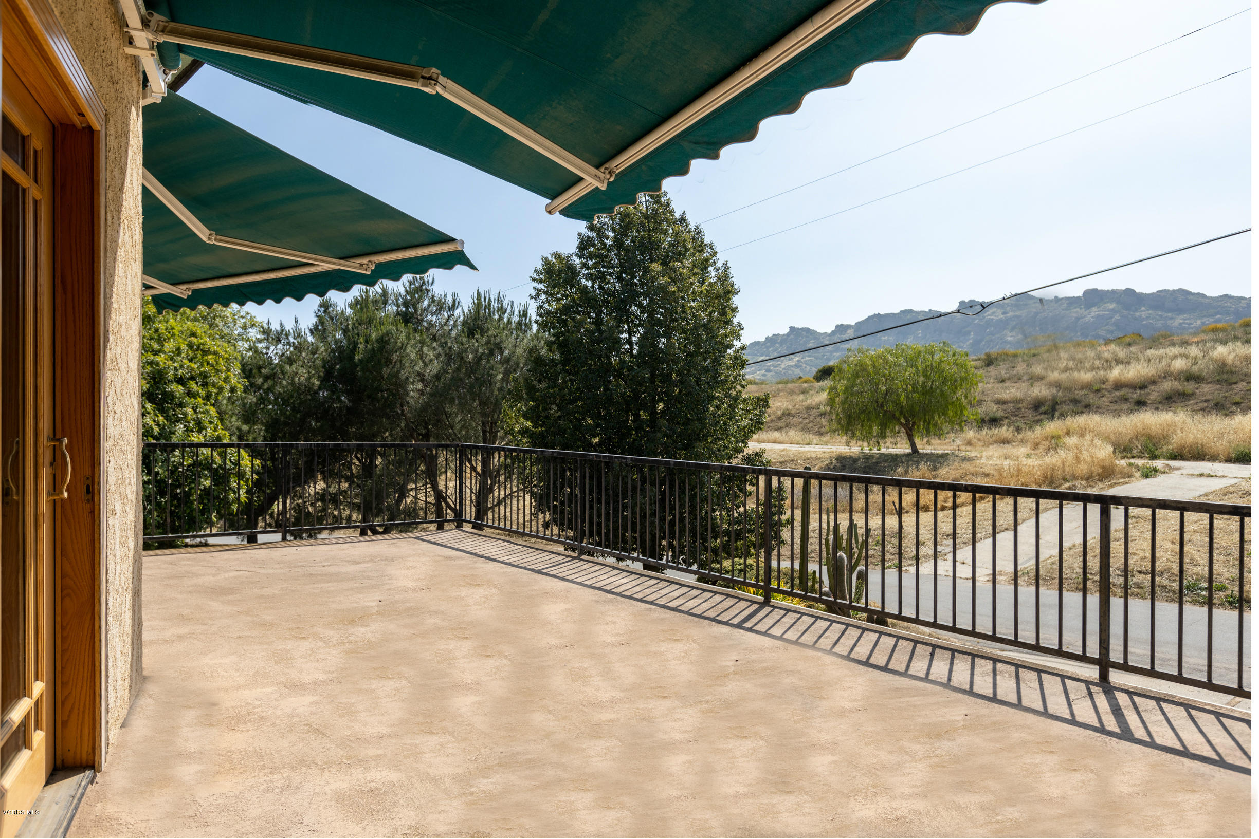 7240 Studio Road Canoga Park, CA 91304 - Photo 5 of 19 a view of balcony with a couple of trees