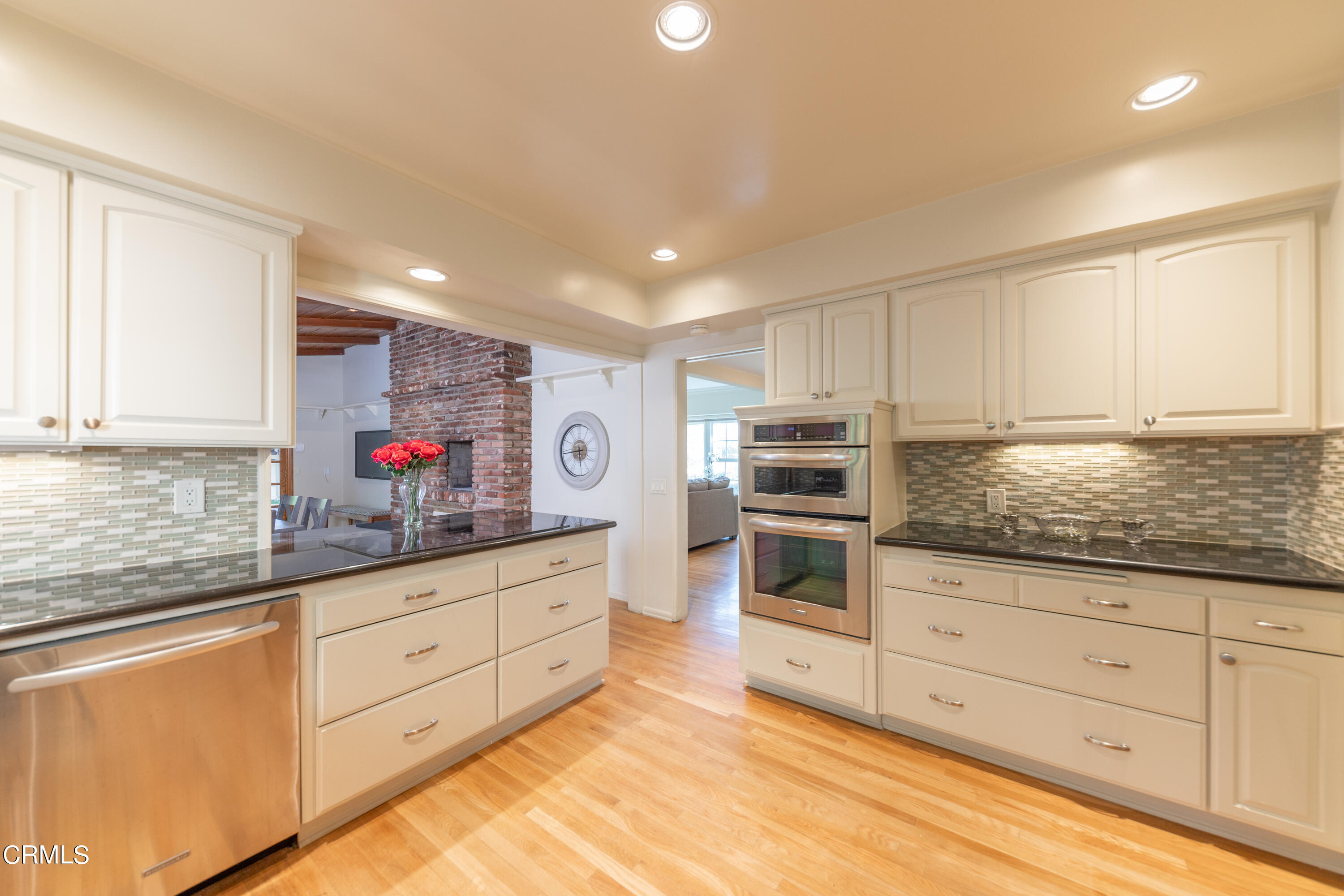 5028 Ramsdell Avenue La Crescenta, CA 91214 - Photo 13 of 29 a kitchen with granite countertop white cabinets and stainless steel appliances