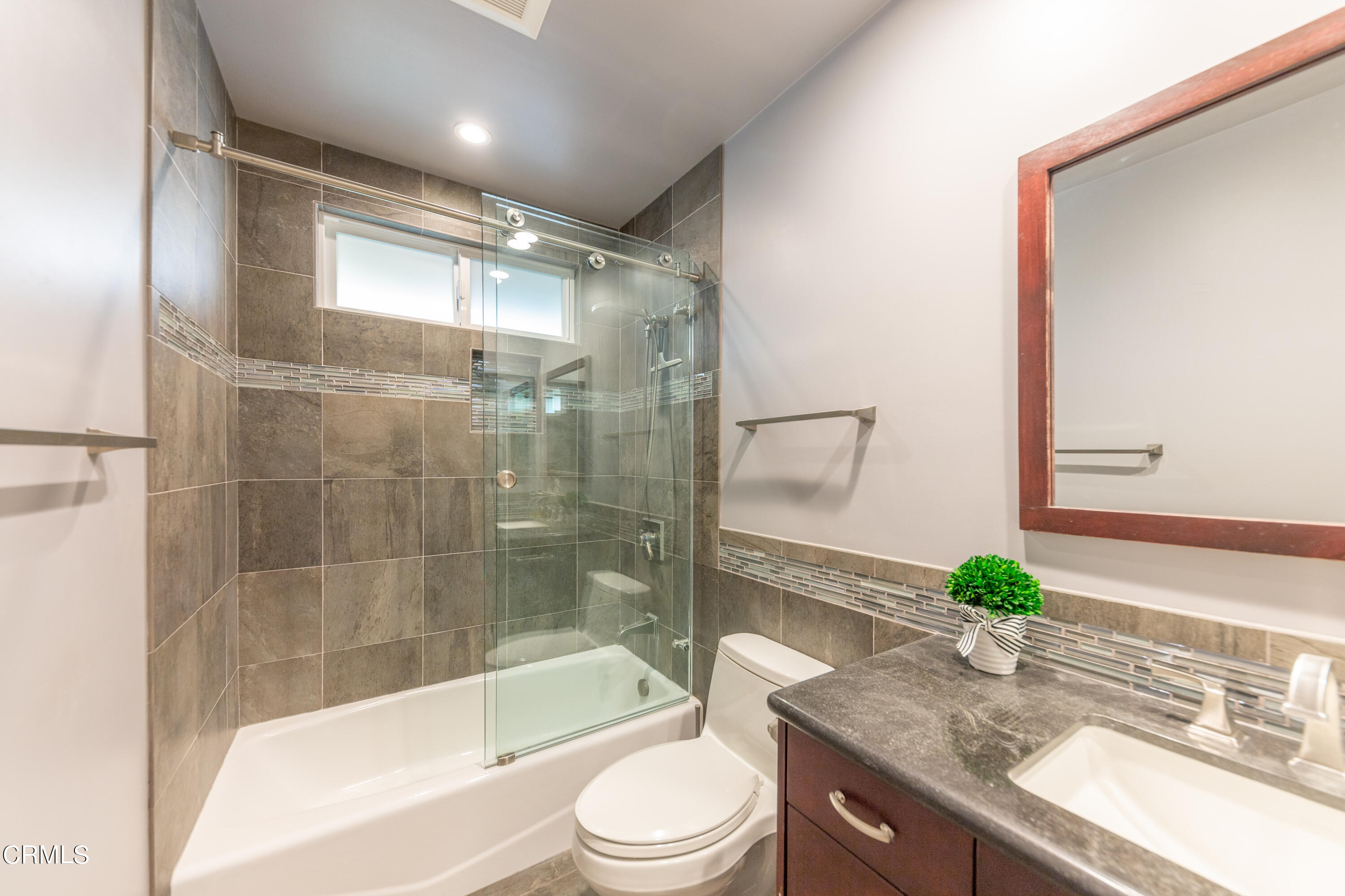 5028 Ramsdell Avenue La Crescenta, CA 91214 - Photo 18 of 29 a bathroom with a granite countertop sink a toilet and shower
