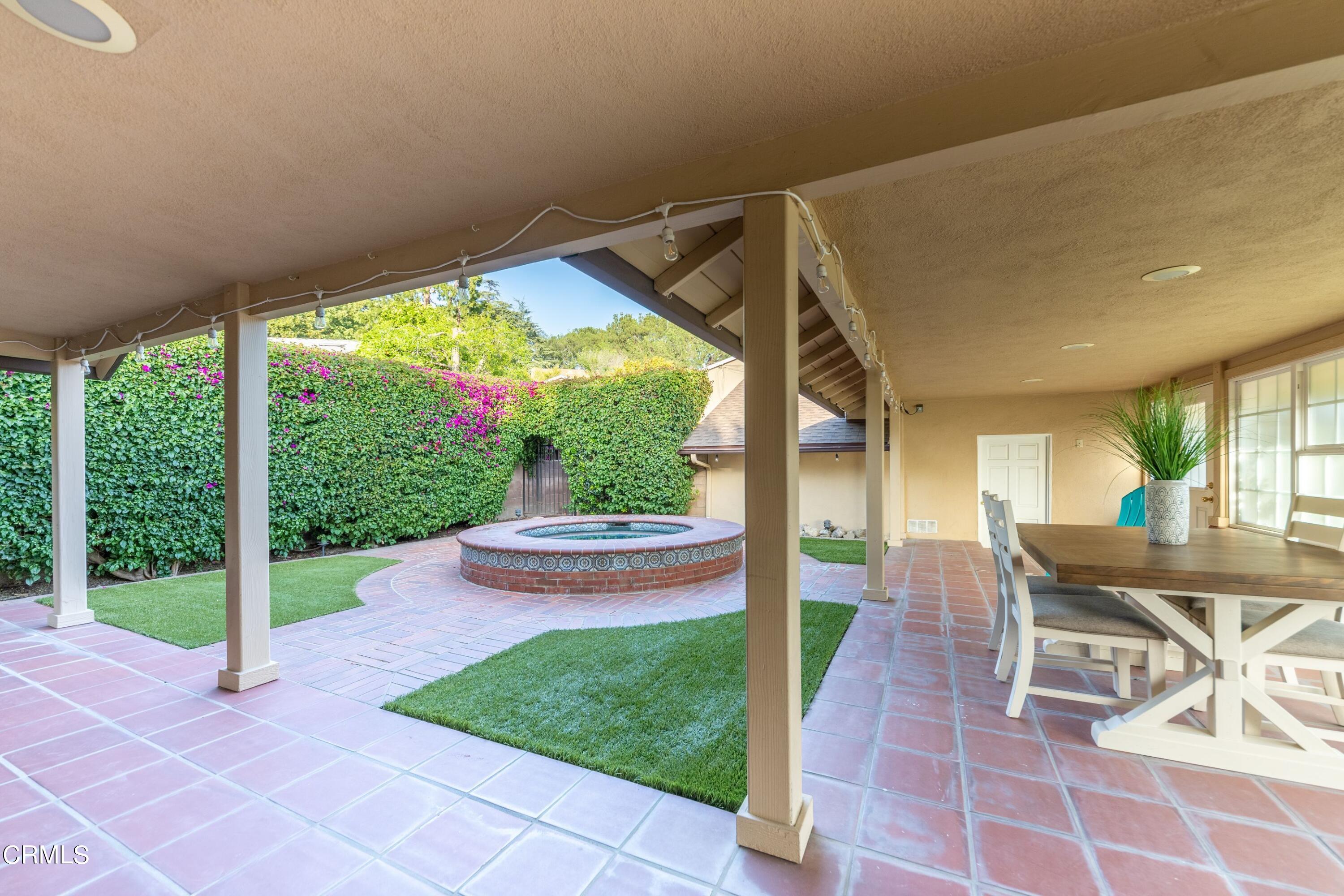 5028 Ramsdell Avenue La Crescenta, CA 91214 - Photo 20 of 29 a view of a patio with a table chairs and a backyard