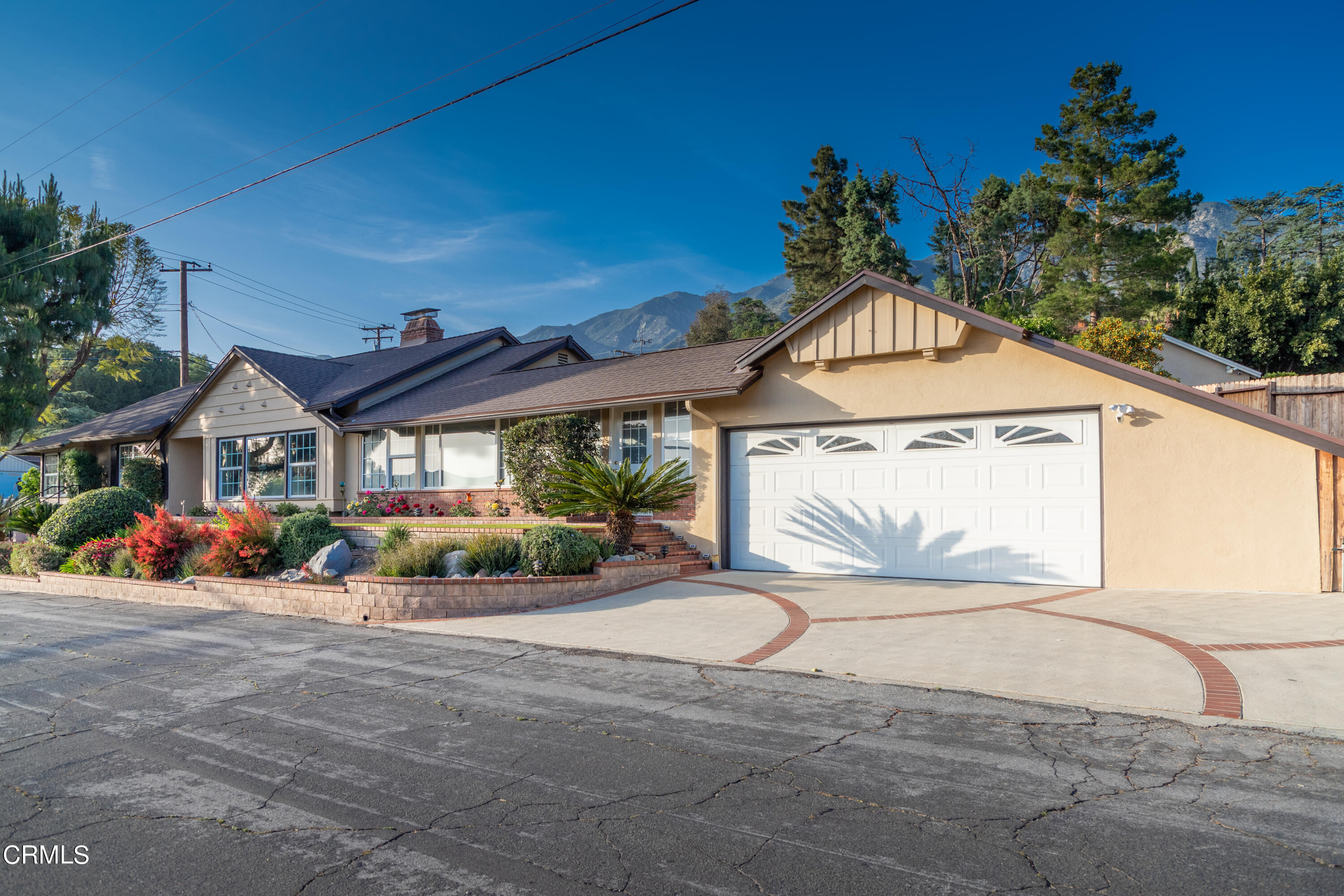 5028 Ramsdell Avenue La Crescenta, CA 91214 - Photo 3 of 29 a front view of a house with a yard and garage