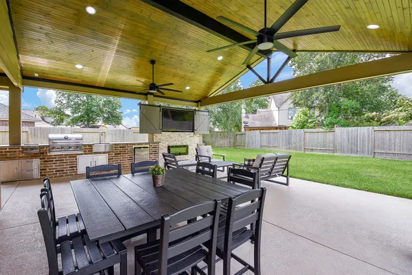 a view of an outdoor dining space with furniture