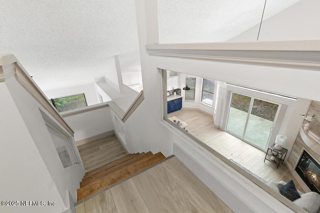 5497 Spring Brook Road Jacksonville, FL 32277 - Photo 39 of 54 a living room with furniture and a fireplace