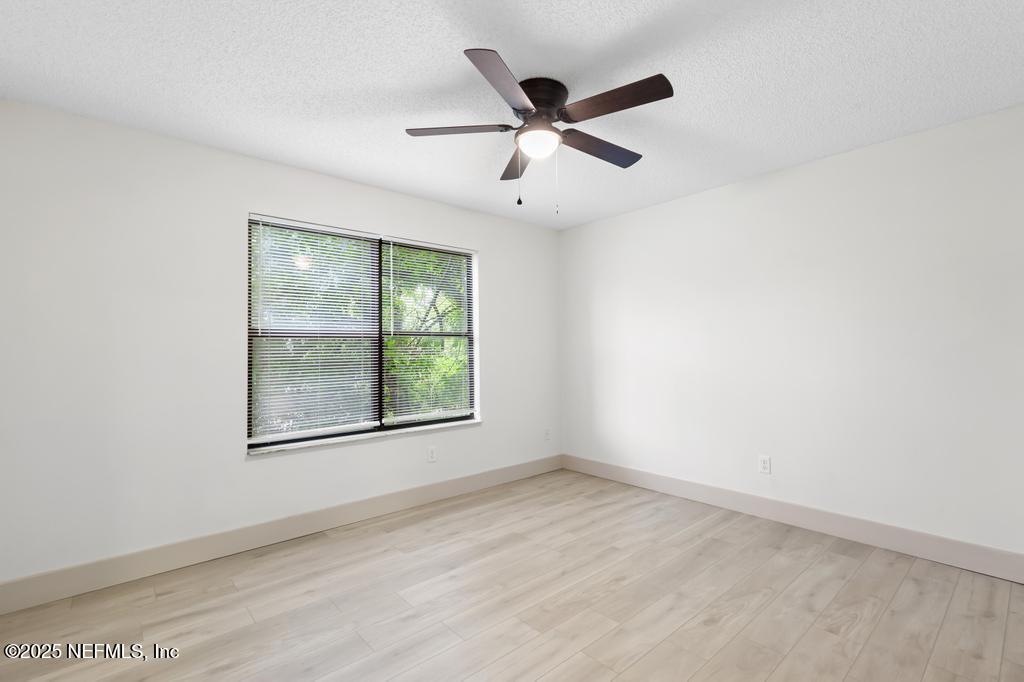 5497 Spring Brook Road Jacksonville, FL 32277 - Photo 41 of 54 an empty room with a window