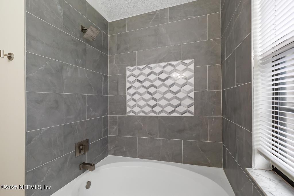 5497 Spring Brook Road Jacksonville, FL 32277 - Photo 46 of 54 a bathroom with a shower
