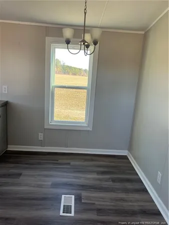 a room with window and wooden floor