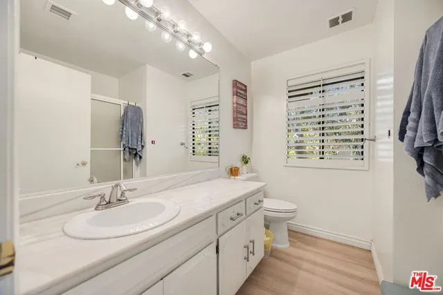 a bathroom with a sink double vanity and a bathtub