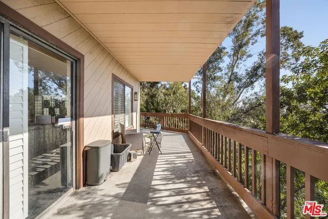a view of balcony with wooden floor and outdoor space