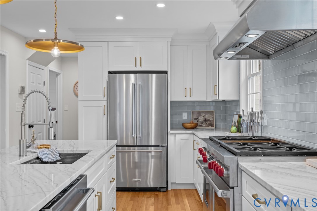 1017 Ridge Top Road Henrico, VA 23229 - Photo 12 of 37 a kitchen with stainless steel appliances granite countertop a sink stove and refrigerator